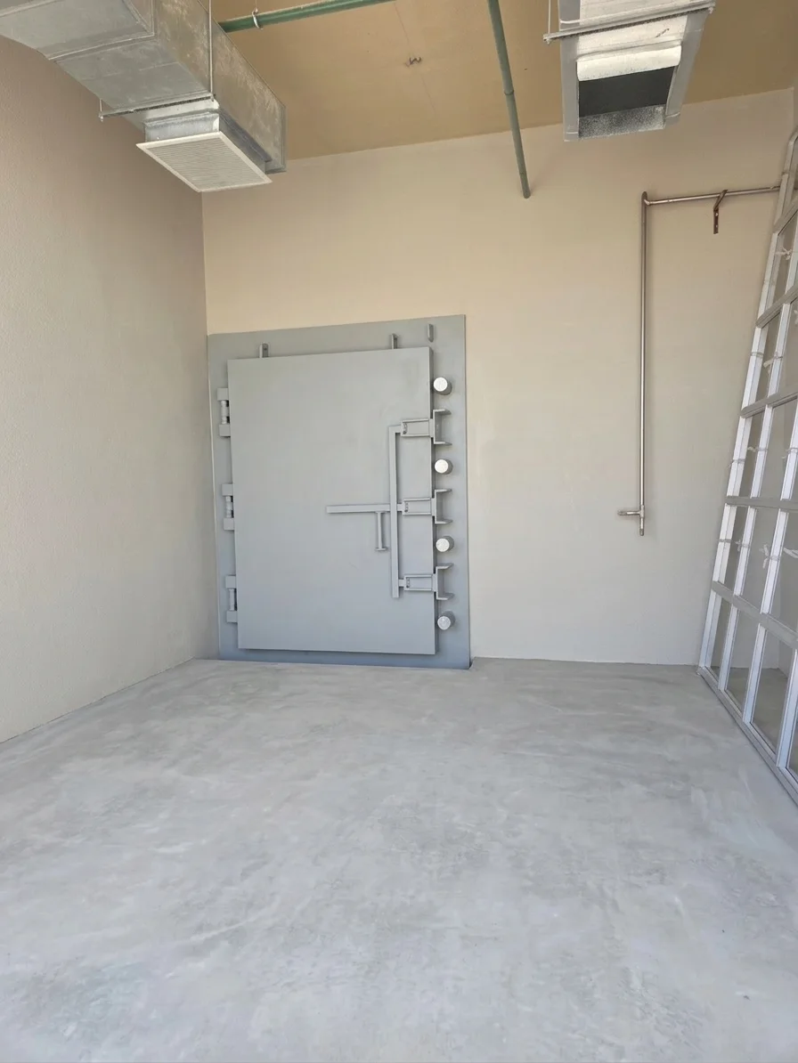 Retouched project photograph of an installed protective door, a separate assembly from the engineering model