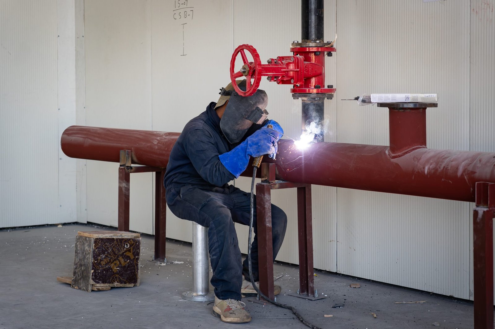 Welding a firefighting ring main on a live site
